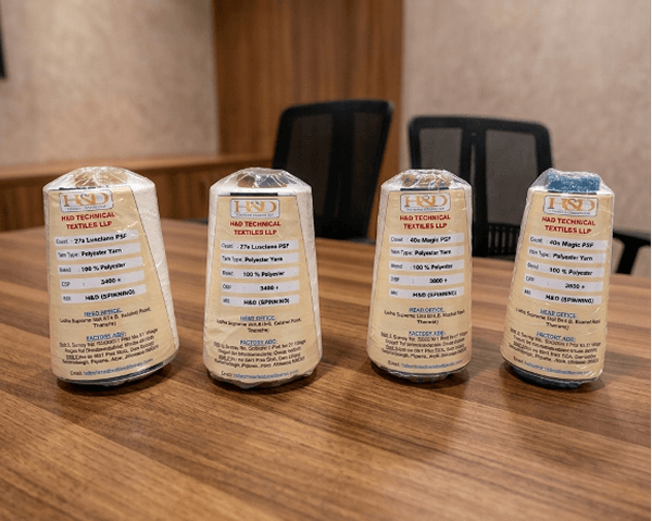 H&D branded yarn cones with quality labels
